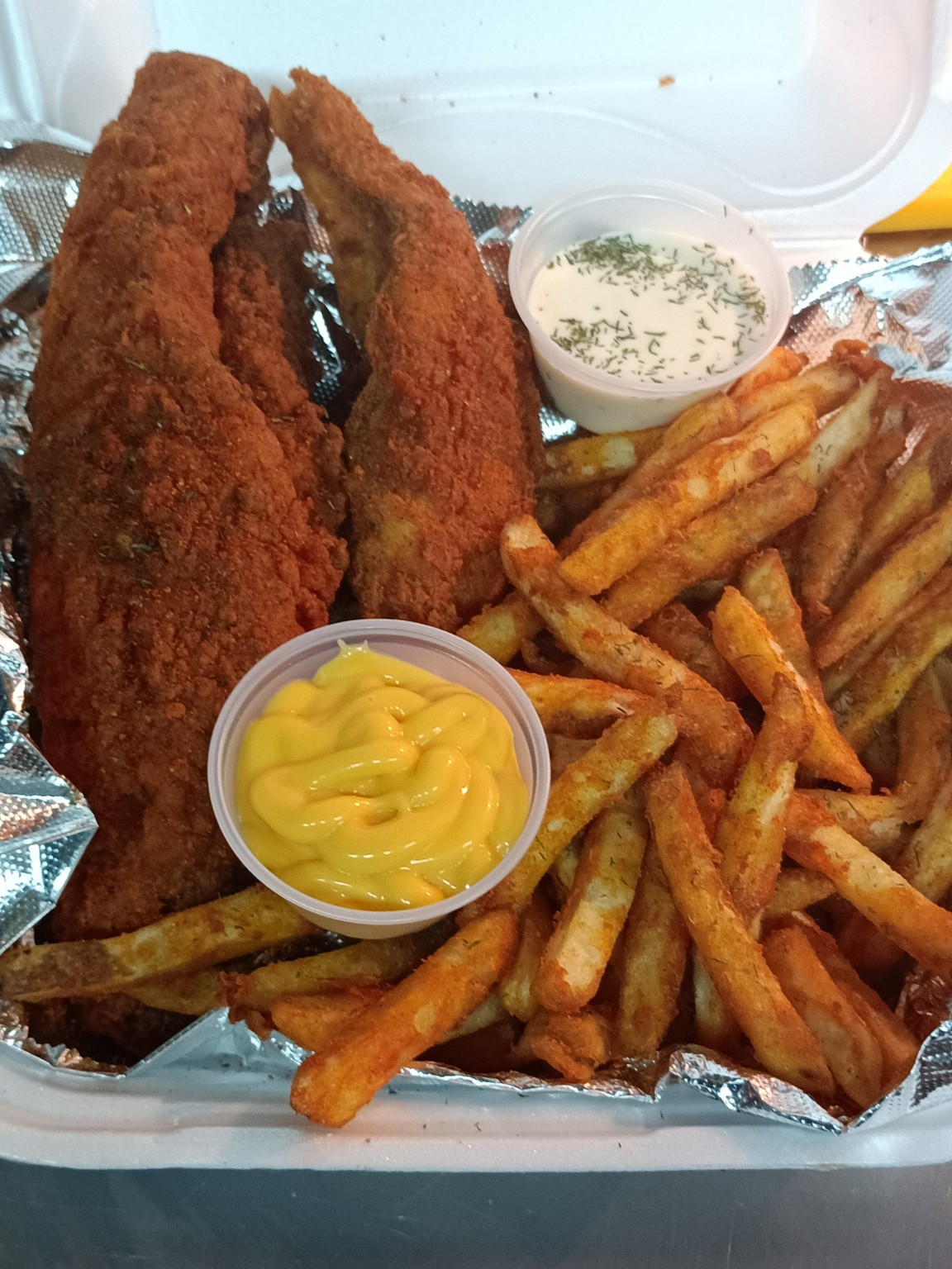 Seasoned chicken tenders with fries
