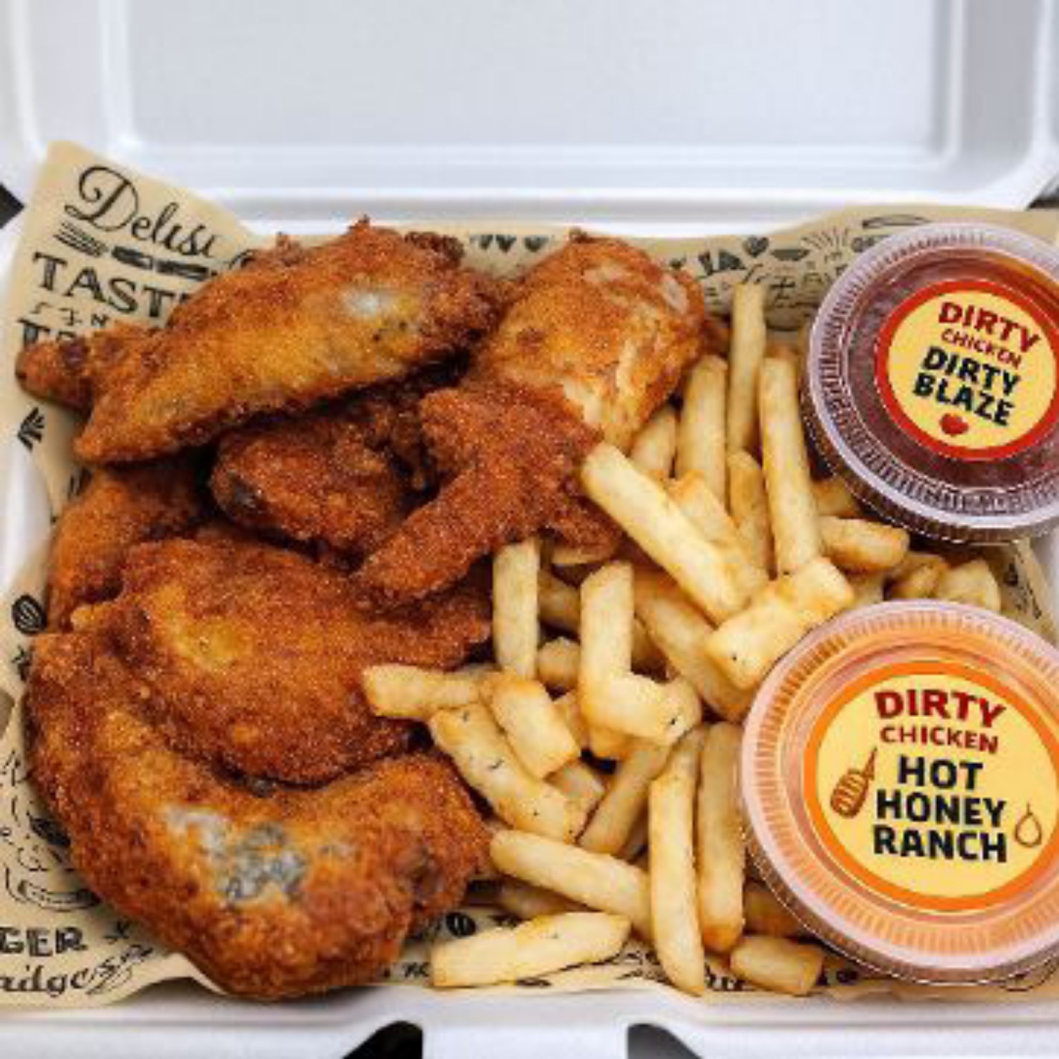 Dirty Chicken wings and fries with house sauces